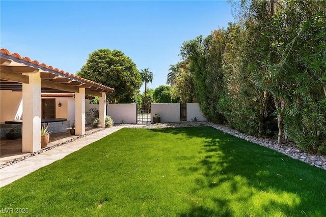 view of yard with a gate and a pergola