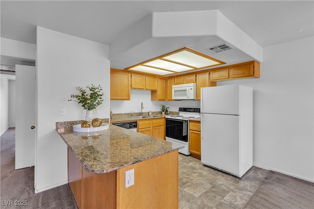 8410 Eldora Ave Unit 2045, Las Vegas, NV 89117 - kitchen featuring white appliances, a peninsula, and light stone counters