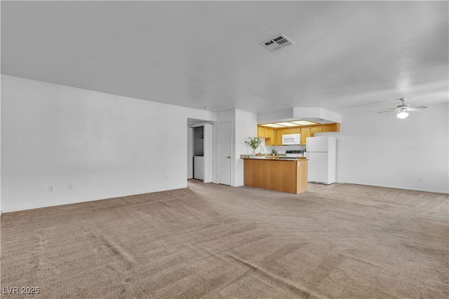 8410 Eldora Ave Unit 2045, Las Vegas, NV 89117 - unfurnished living room featuring light colored carpet and ceiling fan