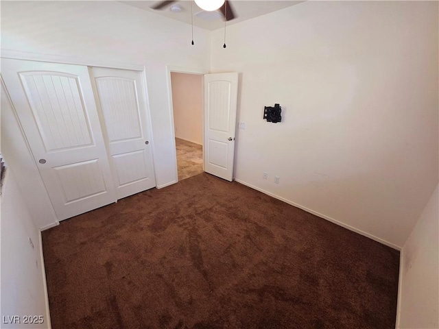 unfurnished bedroom with carpet and a closet