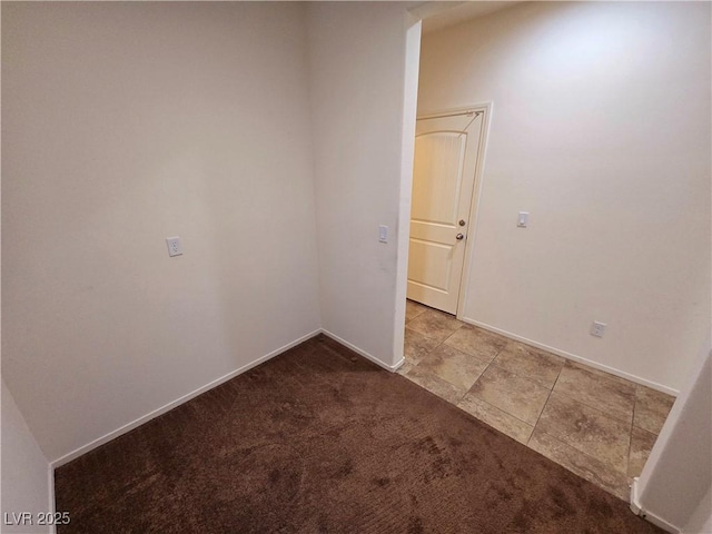 unfurnished room featuring tile patterned flooring, baseboards, and carpet flooring