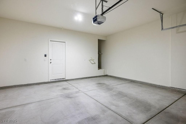 4032 Little Bay Ave, North Las Vegas, NV 89081 - garage with a garage door opener and baseboards