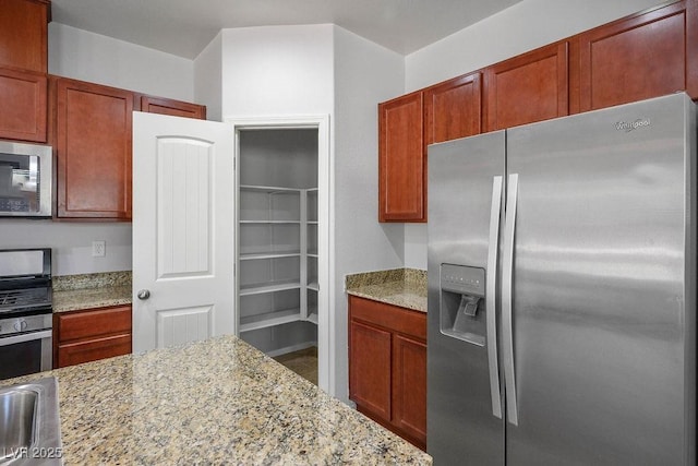 4032 Little Bay Ave, North Las Vegas, NV 89081 - kitchen featuring appliances with stainless steel finishes and light stone counters