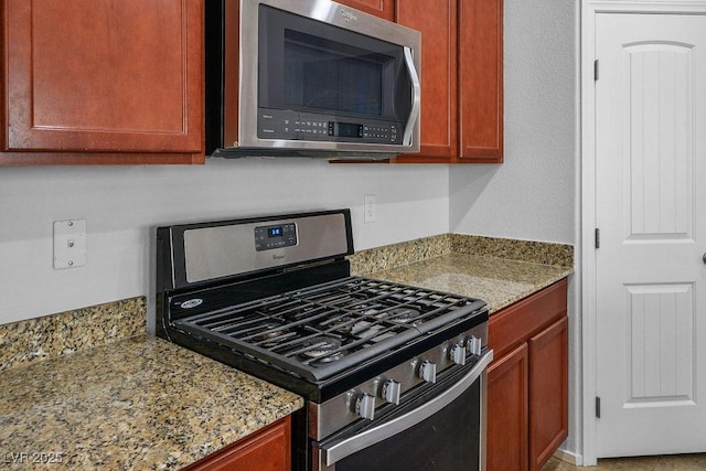 4032 Little Bay Ave, North Las Vegas, NV 89081 - kitchen with stainless steel appliances and light stone countertops