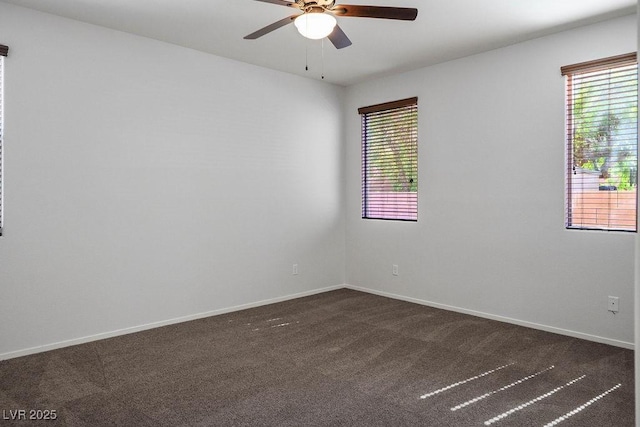 4032 Little Bay Ave, North Las Vegas, NV 89081 - empty room with dark carpet, a ceiling fan, and baseboards