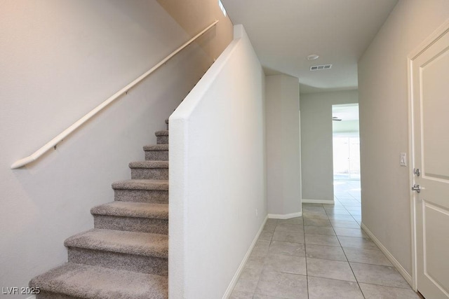 9871 Magnus Ct, Las Vegas, NV 89178 - stairway with tile patterned floors and baseboards