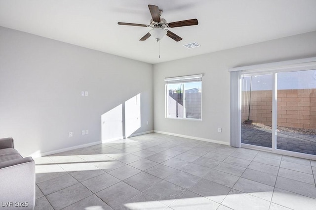 9871 Magnus Ct, Las Vegas, NV 89178 - spare room featuring plenty of natural light, ceiling fan, tile patterned flooring, and baseboards