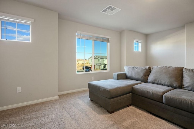 9871 Magnus Ct, Las Vegas, NV 89178 - living room featuring baseboards and light carpet