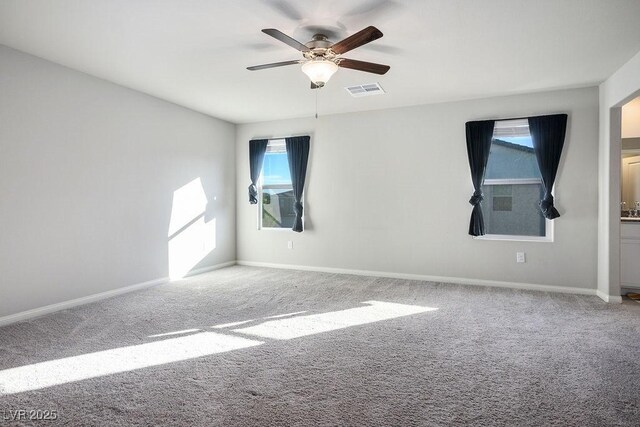 9871 Magnus Ct, Las Vegas, NV 89178 - spare room featuring carpet, a ceiling fan, and healthy amount of natural light