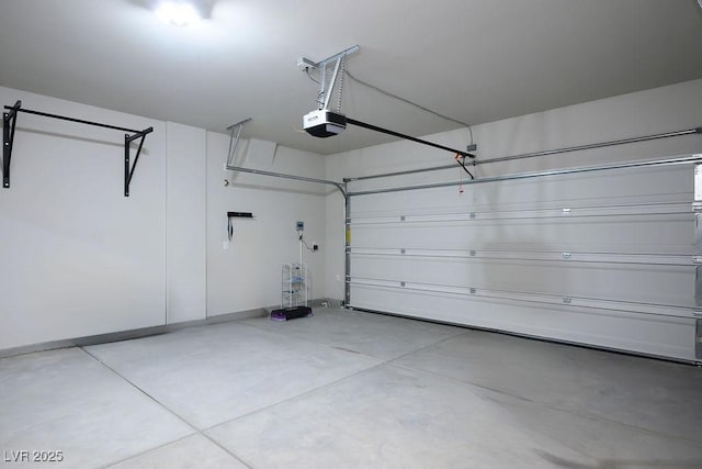 9871 Magnus Ct, Las Vegas, NV 89178 - garage featuring a garage door opener and baseboards