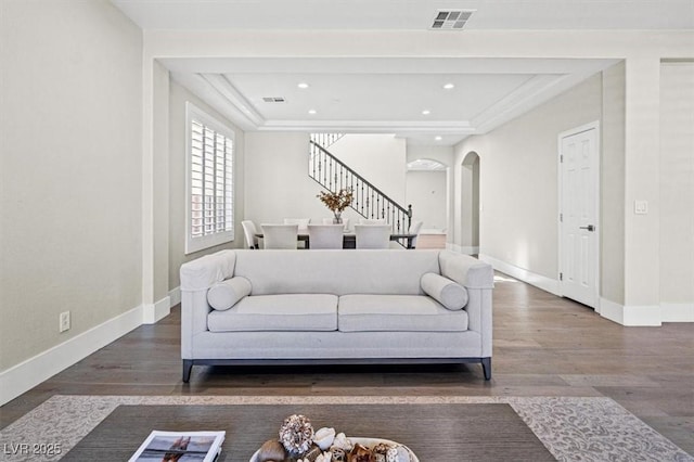 6335 Mount Eden Ave, Las Vegas, NV 89139 - living room with arched walkways, stairs, wood finished floors, baseboards, and recessed lighting