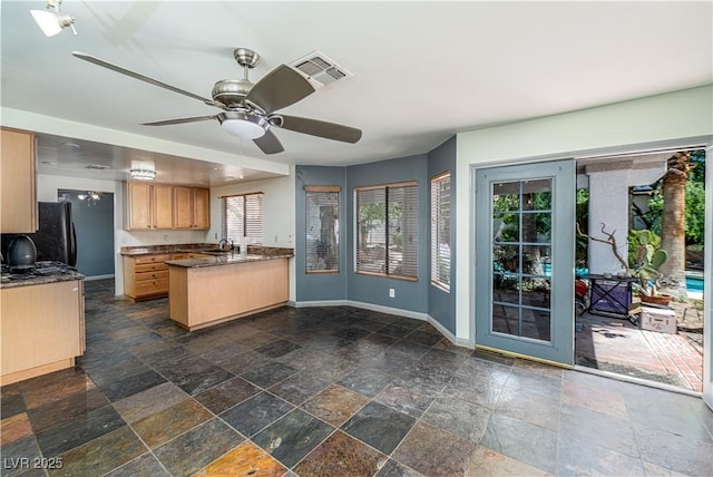 2812 Shadow Creek Cir, Las Vegas, NV 89117 - kitchen with stone tile flooring, visible vents, a peninsula, baseboards, and ceiling fan