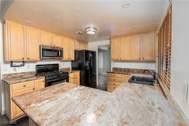 2812 Shadow Creek Cir, Las Vegas, NV 89117 - kitchen with baseboards, a sink, light brown cabinetry, and black appliances
