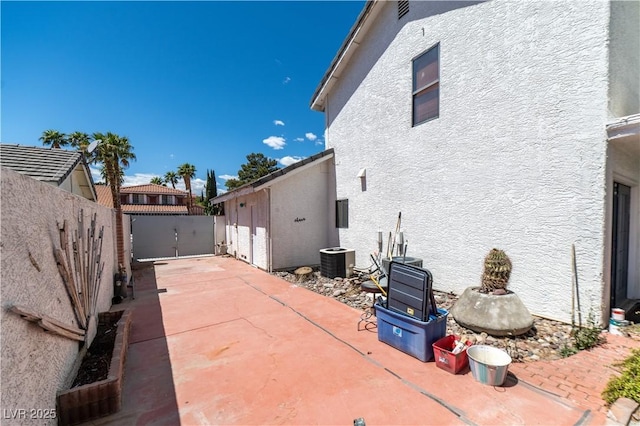 2812 Shadow Creek Cir, Las Vegas, NV 89117 - view of home's exterior featuring fence, stucco siding, a patio area, and central AC