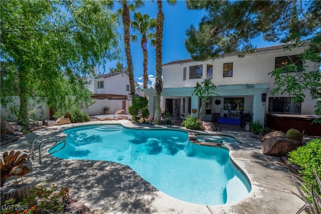 2812 Shadow Creek Cir, Las Vegas, NV 89117 - view of swimming pool featuring a patio, a pool with connected hot tub, french doors, and a fenced backyard