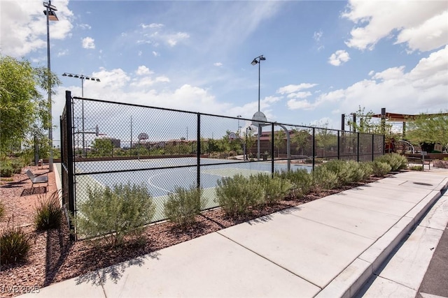 view of sport court with fence