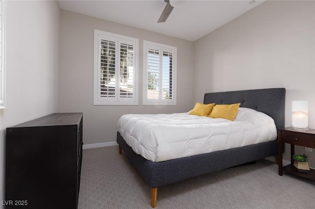 bedroom with baseboards, carpet, and a ceiling fan