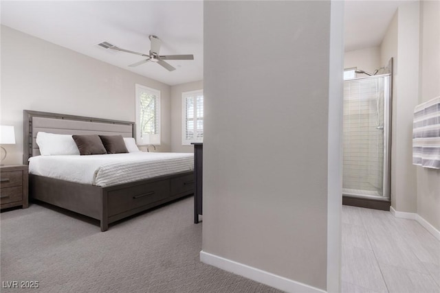 bedroom featuring baseboards, ceiling fan, and visible vents
