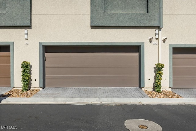 garage featuring driveway