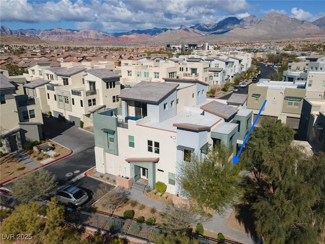 aerial view featuring a mountain view and a residential view