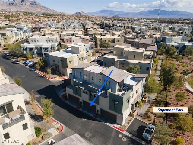 drone / aerial view with a mountain view and a residential view