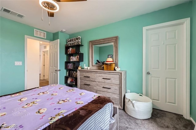 bedroom with carpet, visible vents, and a ceiling fan