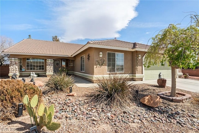 ranch-style house with an attached garage, stone siding, a tile roof, stucco siding, and driveway