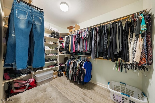 spacious closet with wood finished floors