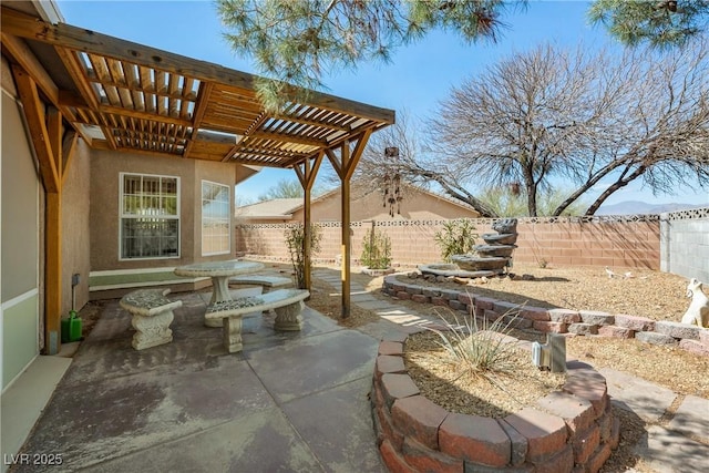 view of patio / terrace featuring a pergola and a fenced backyard