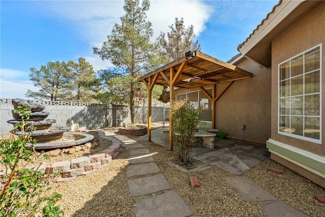 view of yard featuring a patio and fence