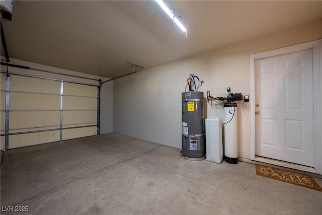 garage featuring strapped water heater and a garage door opener
