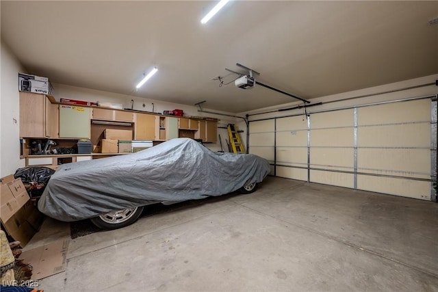 garage featuring a garage door opener