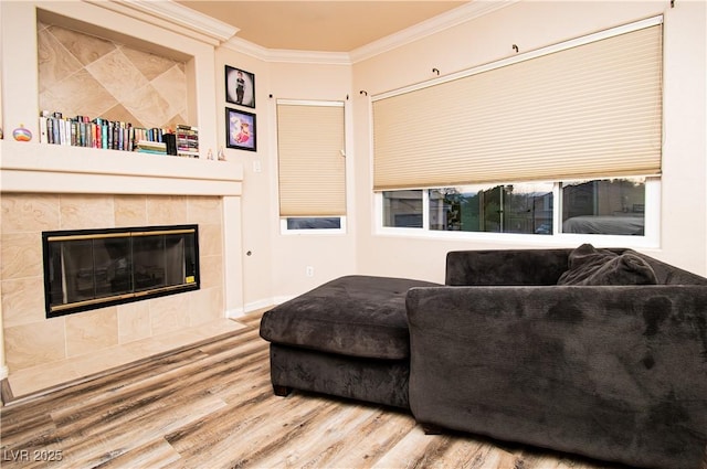 1017 Fairbury St, Henderson, NV 89052 - living area with wood finished floors, a tile fireplace, and ornamental molding