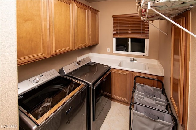1017 Fairbury St, Henderson, NV 89052 - laundry area featuring light tile patterned flooring, separate washer and dryer, cabinet space, and a sink