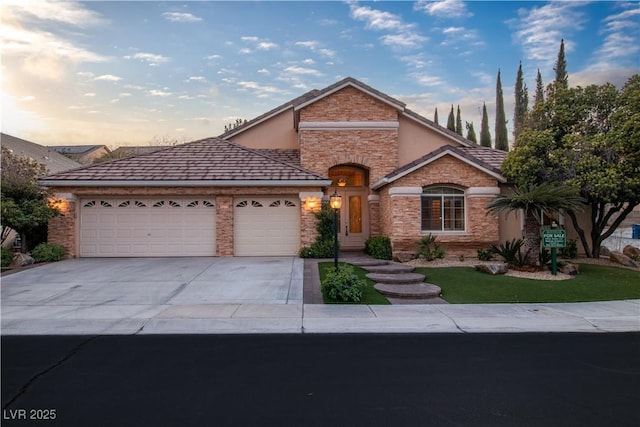 1501 Via Salaria Ct, Henderson, NV 89052 - view of front of property with a garage, stone siding, driveway, and stucco siding