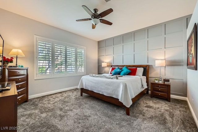 carpeted bedroom with a decorative wall, ceiling fan, and baseboards
