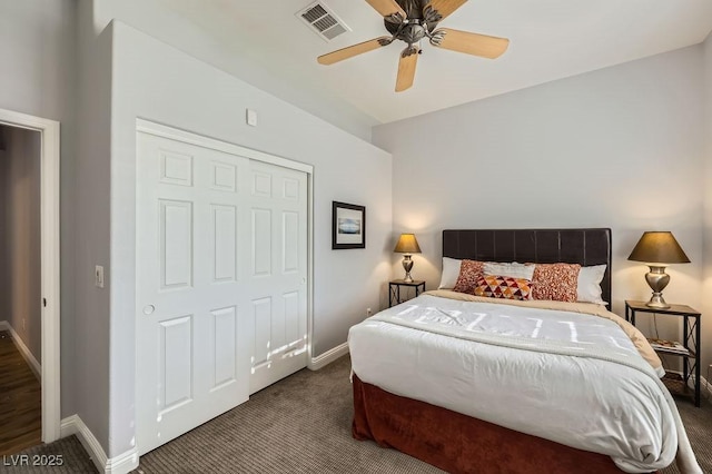 carpeted bedroom featuring baseboards, a ceiling fan, and visible vents