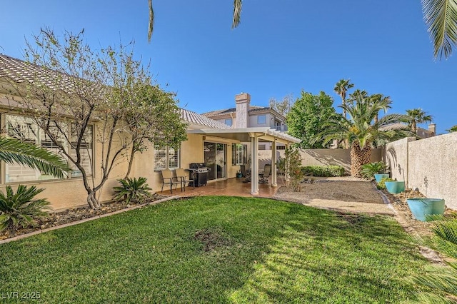 view of yard featuring a patio and a fenced backyard