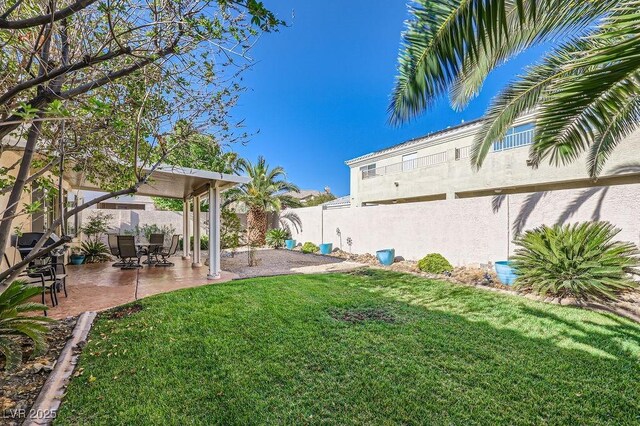 view of yard featuring a patio and fence