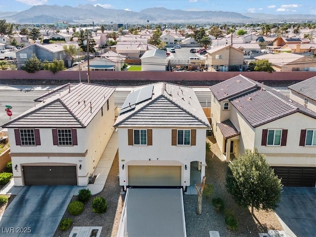 drone / aerial view with a residential view and a mountain view