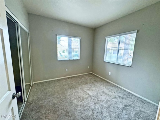 5250 S Rainbow Blvd Unit 1131, Las Vegas, NV 89118 - unfurnished bedroom with carpet floors, a closet, and baseboards