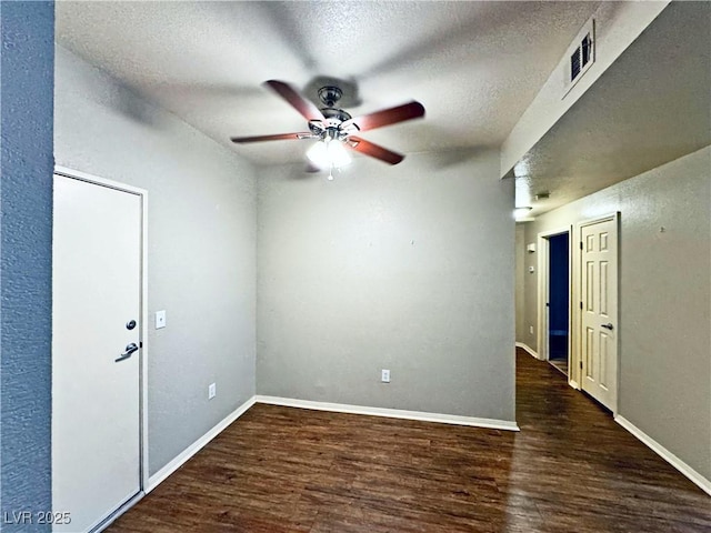 5250 S Rainbow Blvd Unit 1131, Las Vegas, NV 89118 - empty room featuring a ceiling fan, wood finished floors, a textured ceiling, and baseboards