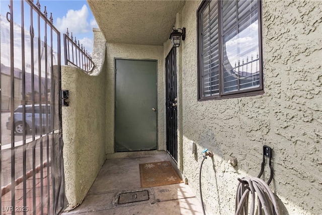 doorway to property with stucco siding