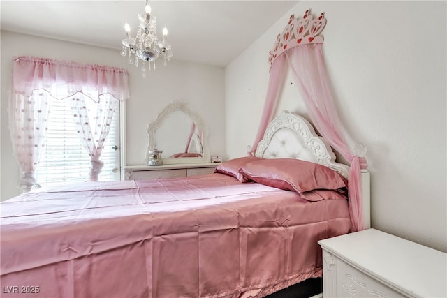 bedroom featuring an inviting chandelier