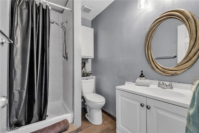 bathroom featuring toilet, visible vents, wood finished floors, a shower stall, and vanity