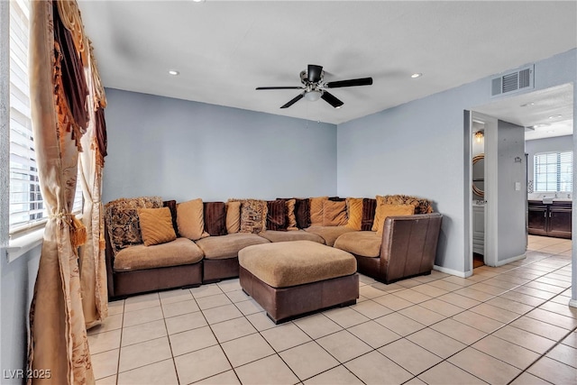 living area featuring light tile patterned flooring, visible vents, ceiling fan, and recessed lighting