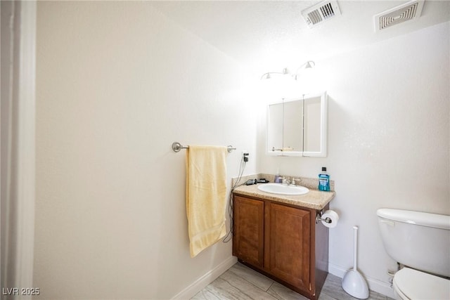 3135 S Mojave Rd Unit 241, Las Vegas, NV 89121 - bathroom featuring visible vents, baseboards, and vanity