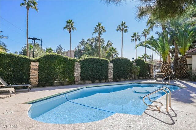 3135 S Mojave Rd Unit 241, Las Vegas, NV 89121 - community pool with fence and a patio