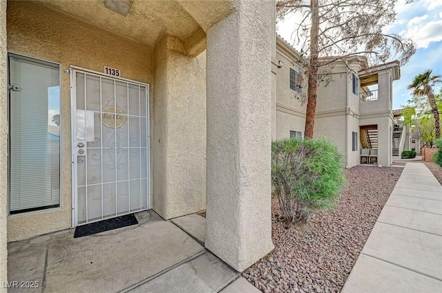 1881 W Alexander Rd Unit 1135, North Las Vegas, NV 89032 - view of exterior entry featuring stucco siding