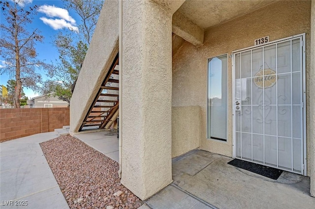 1881 W Alexander Rd Unit 1135, North Las Vegas, NV 89032 - entrance to property featuring stucco siding, fence, and a patio